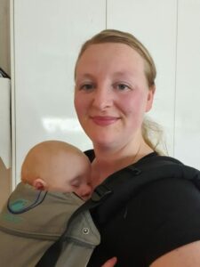 Bec Hansted wearing her baby